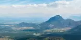 View of Western Ghats mountains under a blue sky and clouds, India