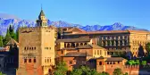 View on Alhambra at sunset with distant mountains in the background, Spain