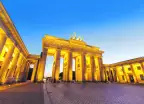 Brandenburg Gate illuminated at night in Berlin, Germany.