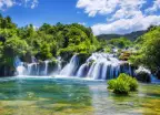 Croatian Krka Park waterfalls surrounded by green trees