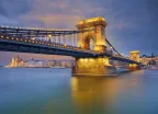 View of Chain Bridge and Budapest illuminated at twilight in Hungary