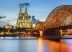 Cologne Cathedral and Hohenzollern bridge illuminated in Cologne, Germany