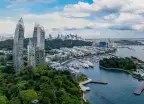 View of Singapore from above, including marina, greenery and skyscrapers