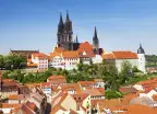 Famous Castle, Albrechtsburg, amongst white houses with orange roofs in in Meissen, Saxony, Germany.
