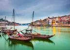 Porto cityscape on the Douro River with traditional Rabelo boats in Portugal