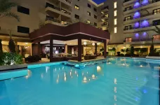 A night time poolside view of the Opera Plaza Hotel, Marrakesh