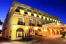The exterior of the Colony Hotel Arkin at night