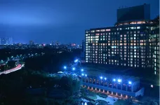 Night aerial view of Hotel New Otani against a distant view of the city of Tokyo, Japan