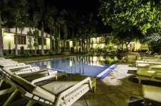 Night view of Hotel Ranthambore peaceful pool and sun loungers