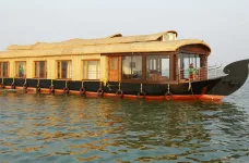 Indian houseboat touring along calm waters 