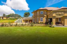 Lush green lawns surrounding the exterior of the Westbury Palace Hotel, Sri Lanka