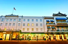 Exterior of Menger Hotel before sunset and it's well lit streets