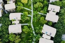 Birds-eye view of the green landscape surrounding the buildings of Chaarya Resort, Sri Lankas of