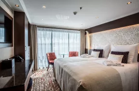 Interior shot of bedroom aboard the Oscar Wilde cruise ship