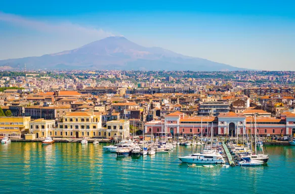 Beautiful view of Catania cruise port with smoking volcano Etna in the background