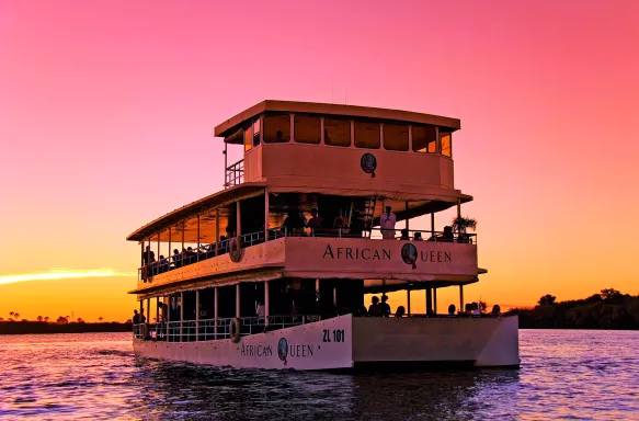 Exterior sunset view of African Queen triple-decker ship at Victoria Falls in Zambia, South Africa