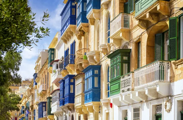 Traditional closed wooden balconies on the streets of Valletta, Malta