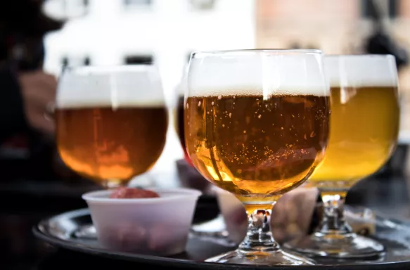 Close-up of three cups of Belgium beer, amber and white