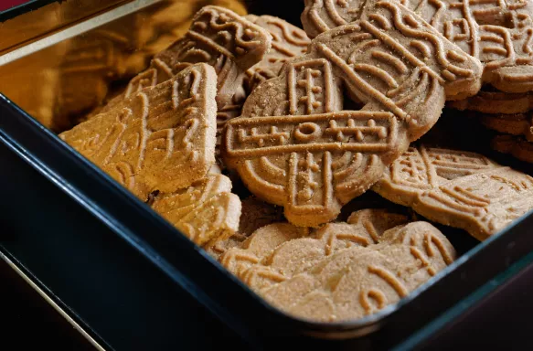 Traditional Speculoos Christmas cookies in a metal tin.