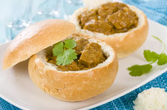 Bunny chow dish, a hallowed-out loaf of white bread filled with curry inside