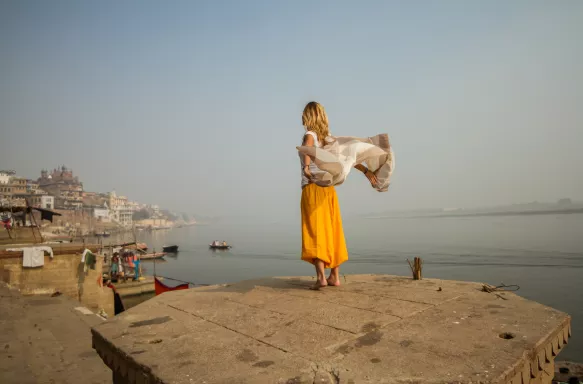 Young woman with shawl by the sacred city of Varanasi, India.