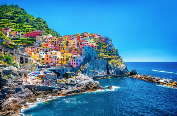 Colourful buildings along the cliffside of Cinque Terre over the Mediterranean sea