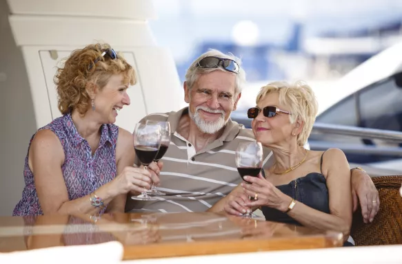 Senior friends drinking wine on vacation