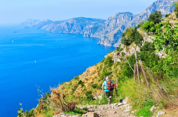 Backpacker walking at the Path of Gods in Amalfi, Italy