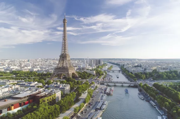 Aerial view of Paris with Eiffel tower and Seine river during sunset, France