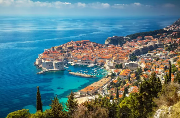 Aerial view of Dubrovnik city with old town houses and beautiful sea waters