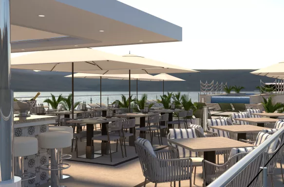 The sun deck on the Porto Mirante cruise ship with a bar, striped sun loungers and comfortable chairs