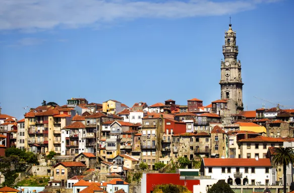 Clerigos church tower and Ribeira old town skyline in Porto, Portugal