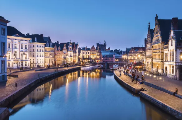 Medieval buildings overlooking harbour on Leie river in Ghent town, Belgium