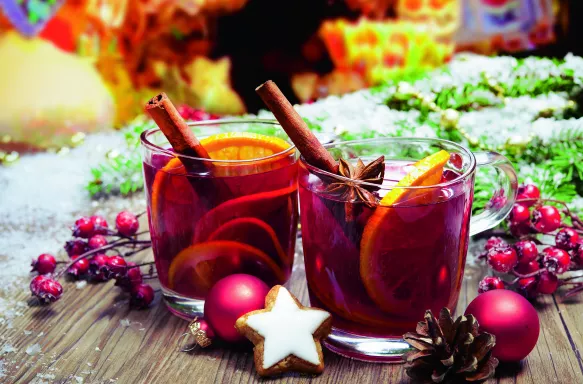 Two decorated glasses of mulled wine at German Christmas market stall