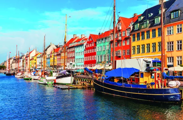 Nyhavn pier with colourful buildings, ships, yachts and other boats in the Old Town of Copenhagen, Denmark.