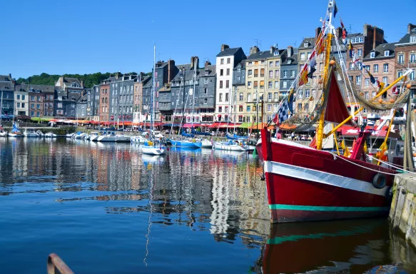 Old Harbour of Honfleur, France, featuring colourful fishing boats