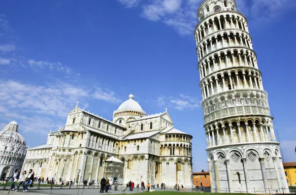 A low ground shot of the leaning tower of Pisa and the Campo dei Miracoli building, Italy