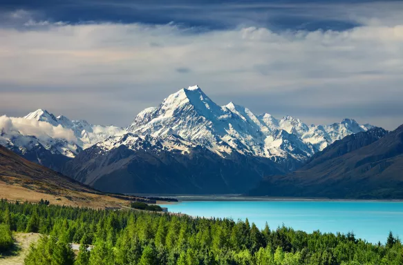 Bright blue water infront of the New Zealand National Park, Mt Cook