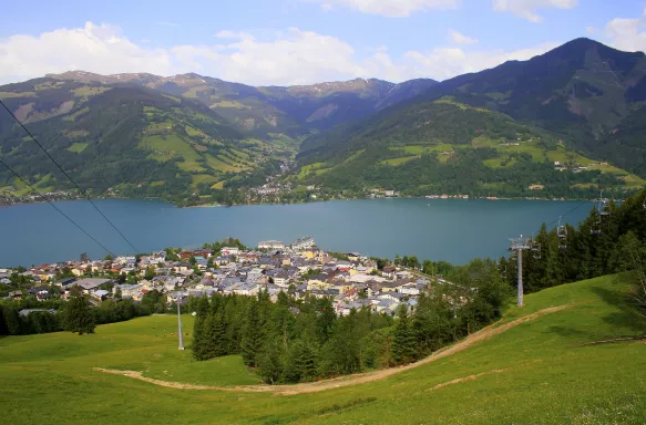 View of Lake Zell and the town of Zell am See from the overlooking green hills