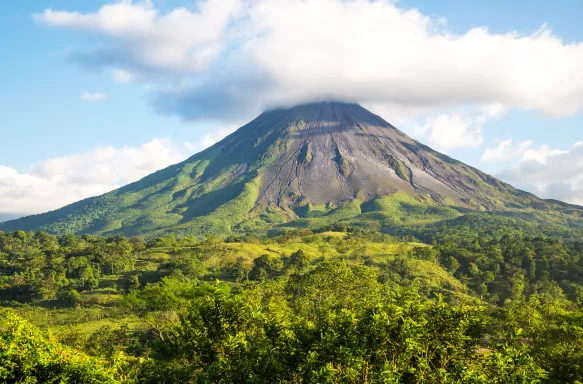 View of Arenal Volcano surrounded by rainforest in Costa Rica