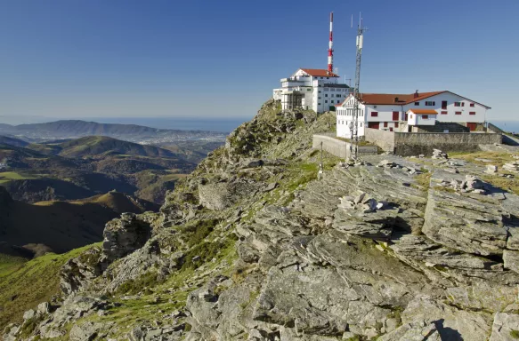 The Larrun Mountain peak overlooking the valley below in Atlantic Pyrenees