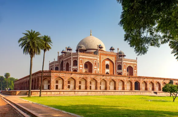 Humayun's Tomb building in the centre of a green lawns and stone pathways, New Delhi, India