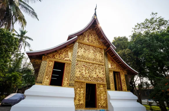 Wat Xiengthong Buddhist temple with gold exterior in Laos