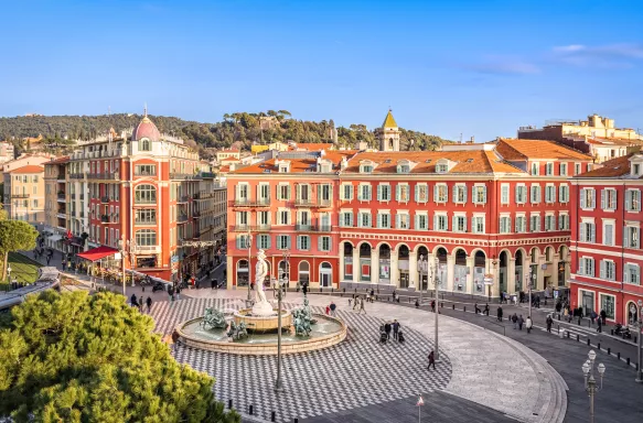 Aerial view of Place Massena square with red buildings and fountain in Nice, France