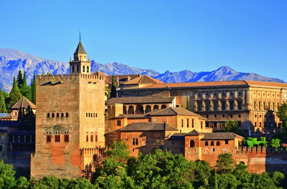 View on Alhambra at sunset with distant mountains in the background, Spain
