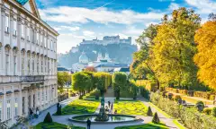 Beautiful view of famous Mirabell Gardens with the old historic Fortress Hohensalzburg in the background in Salzburg, Austria