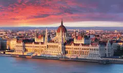 Aerial view of parliament building at dramatic sunrise in Budapest, Hungary