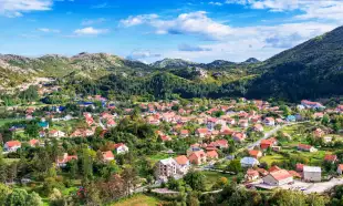 Aerial shot of country houses in Cetinje city, Montenegro