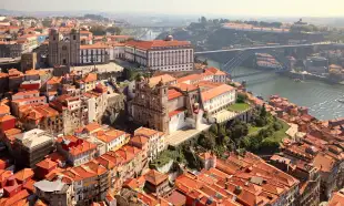 An aerial shot of the Porto Cathedrals next to the Douro River, Portugal