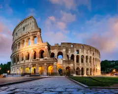 Image of the ancient Colosseum in Rome Italy against a beautiful sunset sky